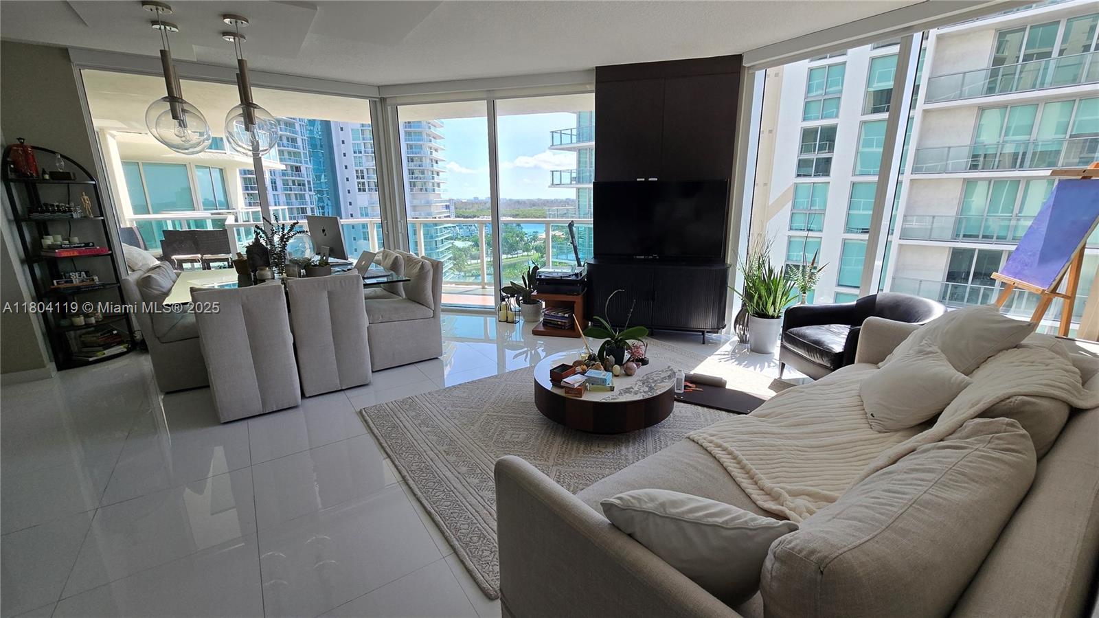 250 Sunny Isles Boulevard, Unit 31603 Sunny Isles Beach, FL 33160 - Photo 9 of 20 a living room with furniture and a large window