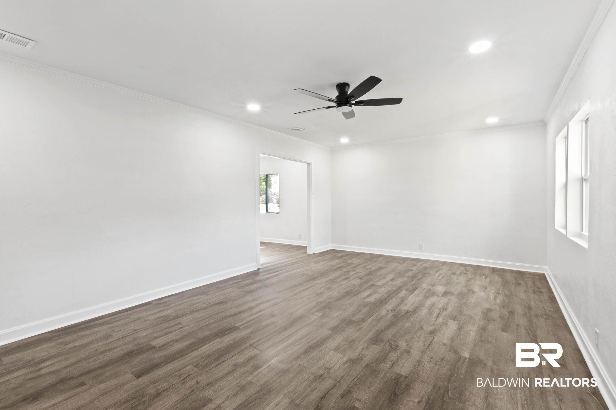 618 Pine Street Saraland, AL 36571 - Photo 9 of 41 Unfurnished room featuring ornamental molding, dark wood finished floors, recessed lighting, and ceiling fan