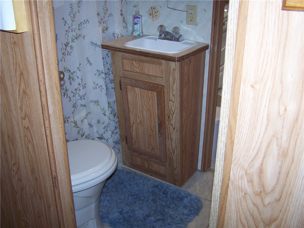 54 Lilly Lane Conquest, NY 13143 - Photo 17 of 21 Bathroom w/ shower and tub!