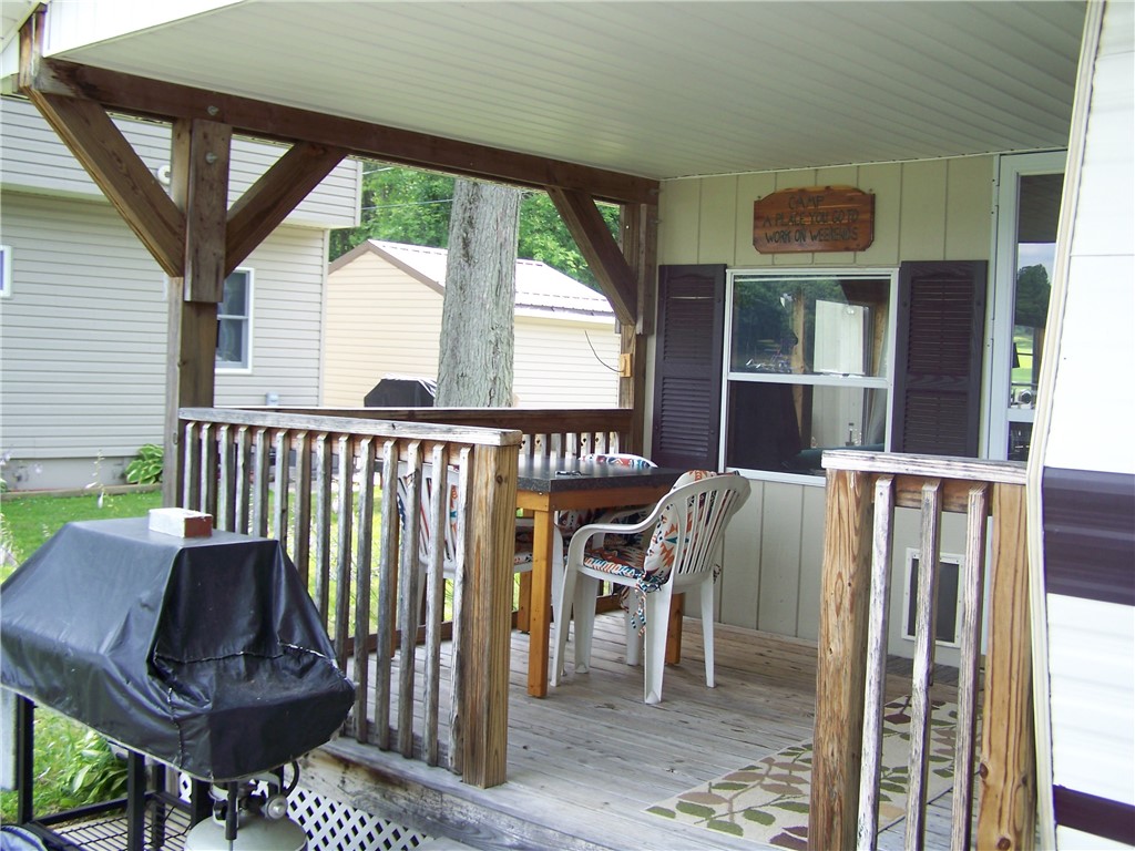 54 Lilly Lane Conquest, NY 13143 - Photo 6 of 21 Rain or shine, this porch will provide hours of re