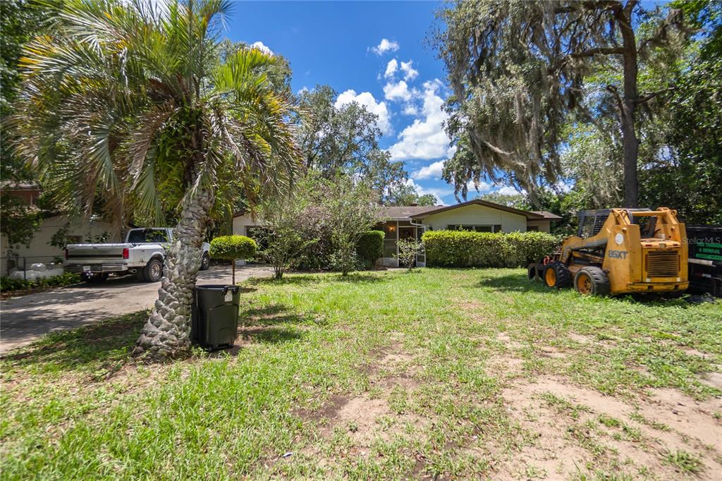 a backyard of a house with lots of green space