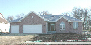 9731 Rambouillet Ridge Roscoe, IL 61073 - Photo 1 of 1 a front view of a house with a yard and garage