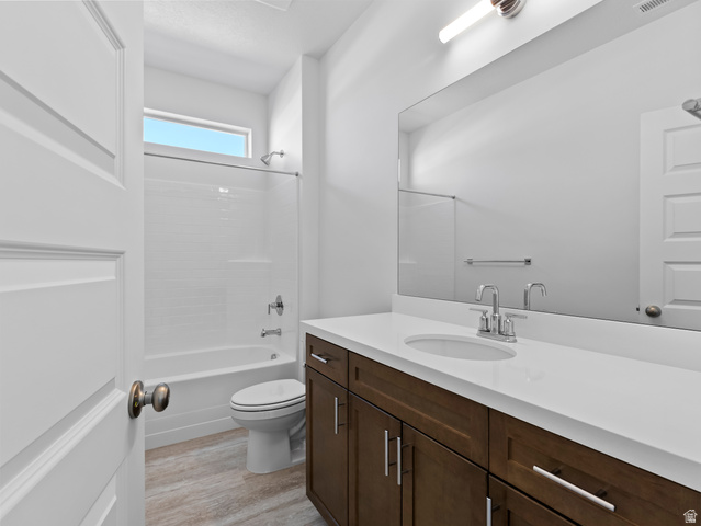 18 South Crimson Way, Unit 304 Mapleton, UT 84664 - Photo 13 of 17 Full bathroom featuring vanity, shower / bath combination, and light wood finished floors
