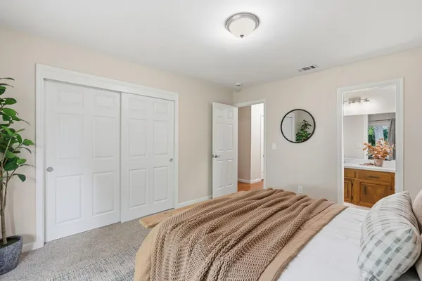 front view of a house with a large window