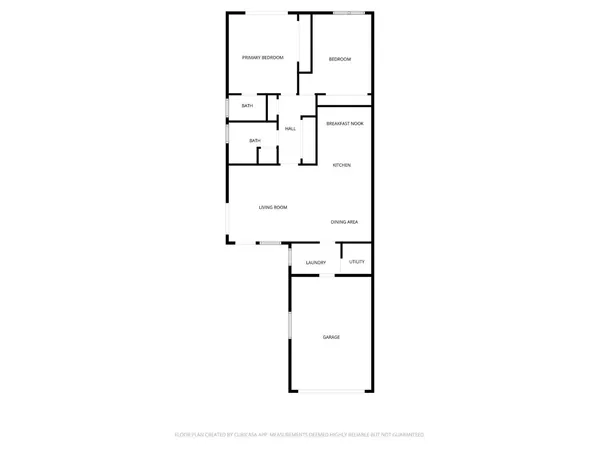 a bedroom with a bed and a potted plant