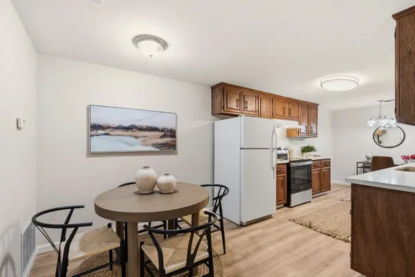 a backyard of a house with plants and tree