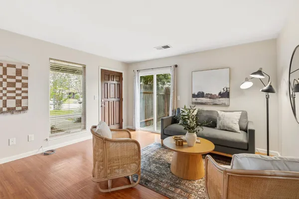 a living room with furniture and a chair