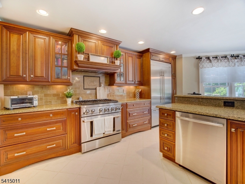 23 Ryerson Road Flemington, NJ 08822 - Photo 9 of 44 a kitchen with stainless steel appliances granite countertop a stove and cabinets