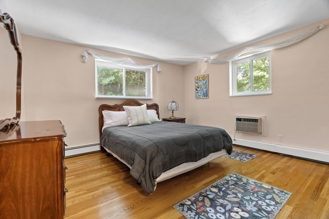 357 Faneuil Street, Unit 12 Boston, MA 02135 - Photo 13 of 15 a bedroom with a bed and window