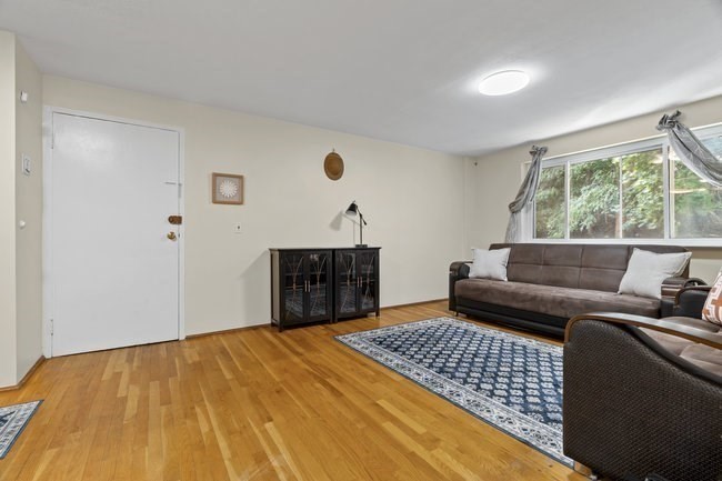 357 Faneuil Street, Unit 12 Boston, MA 02135 - Photo 14 of 15 a living room with furniture and a rug