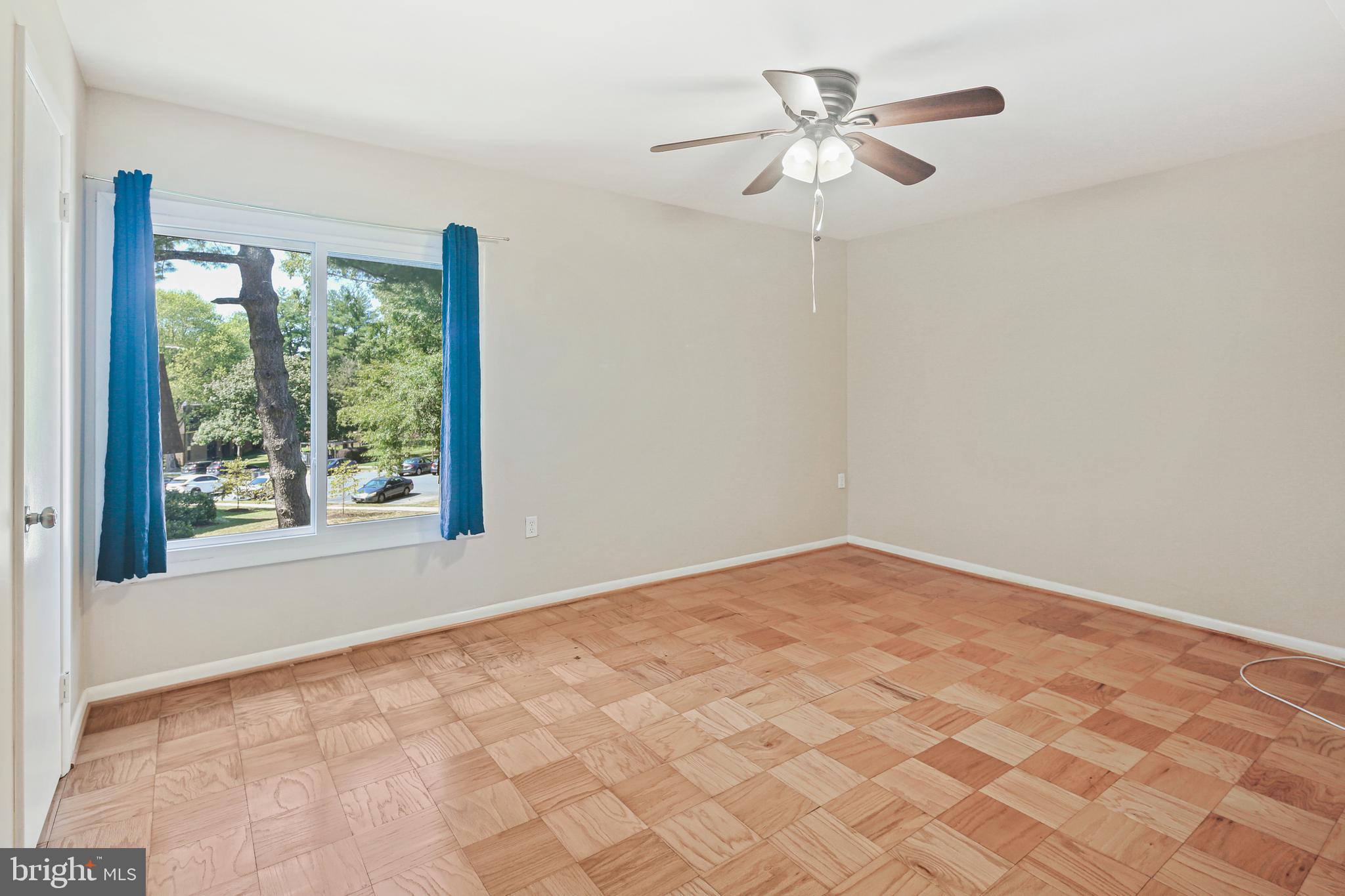 5239 West Running Brook Road, Unit 301 Columbia, MD 21044 - Photo 18 of 33 an empty room with windows and fan