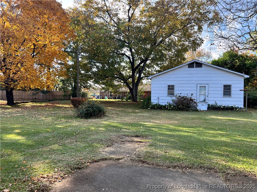 122 Bunker Hill Road Fayetteville, NC 28314 - Photo 2 of 16 a front view of house with yard and trees