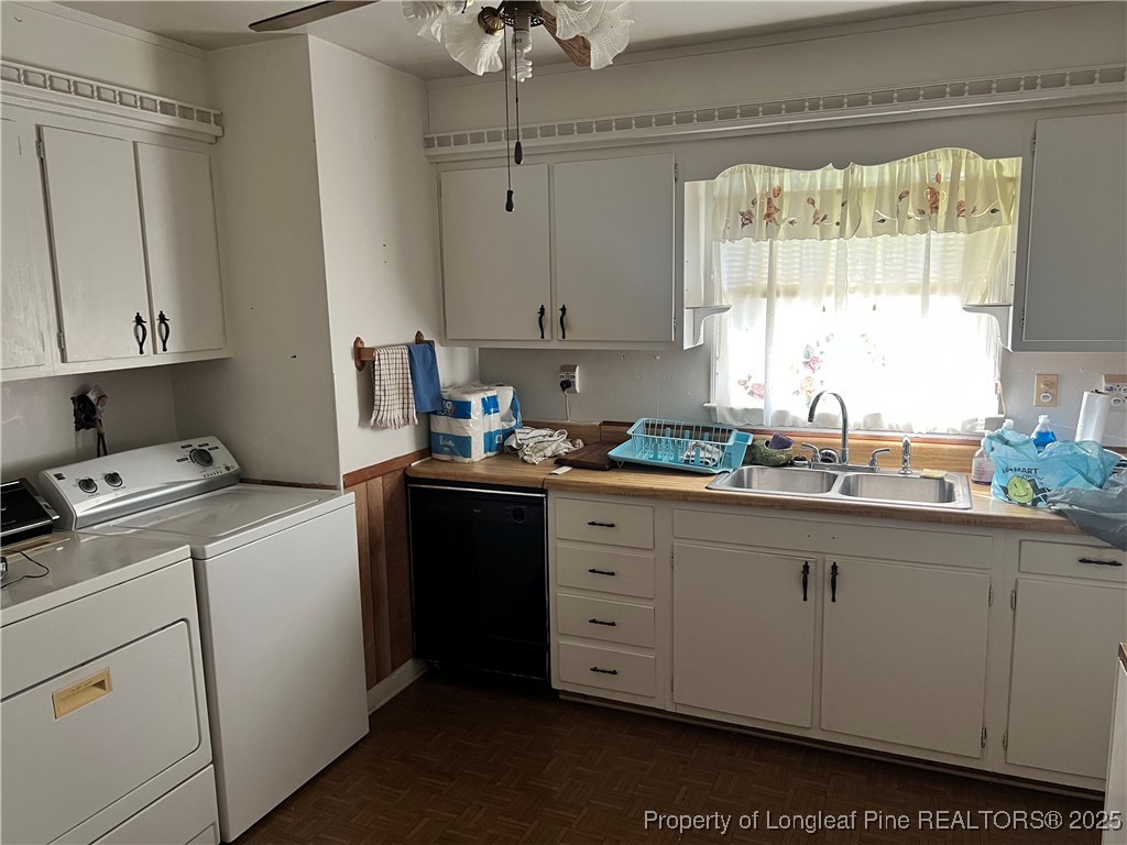 122 Bunker Hill Road Fayetteville, NC 28314 - Photo 4 of 16 a kitchen with sink a window and cabinets