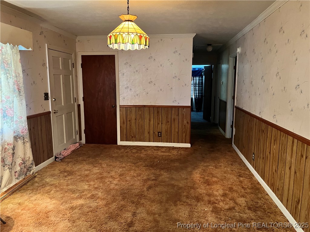 122 Bunker Hill Road Fayetteville, NC 28314 - Photo 10 of 16 an empty room with hallway and chandelier