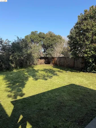 a view of a large swimming pool with a yard