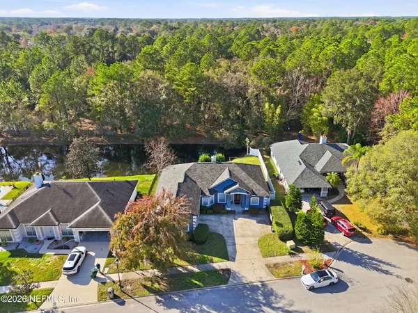 an aerial view of house with yard swimming pool and outdoor seating