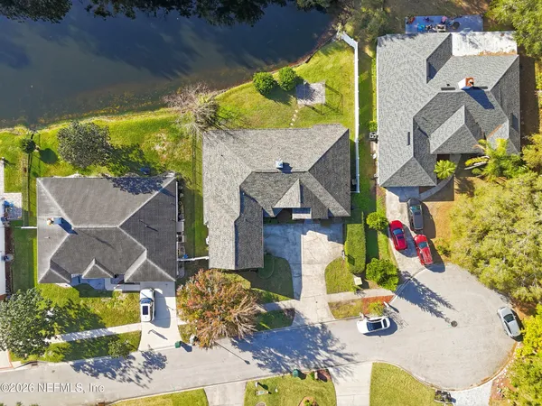 an aerial view of residential house with outdoor space and swimming pool