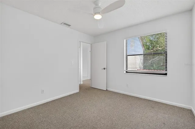 a bathroom with a granite countertop toilet sink and bathtub