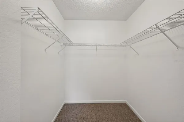 a view of an empty room with glass door