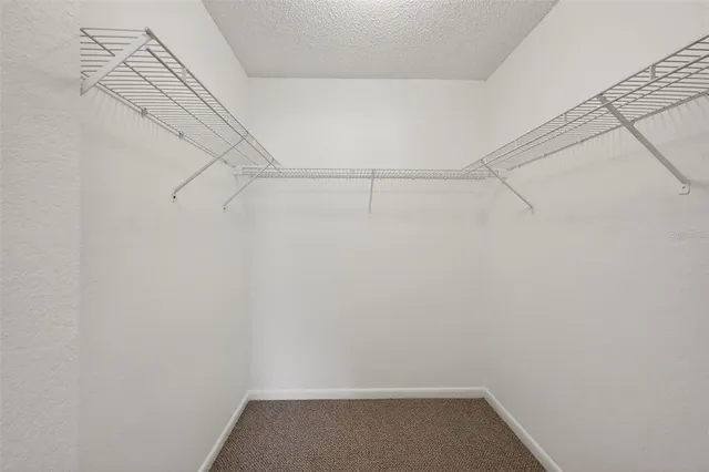 a view of an empty room with glass door