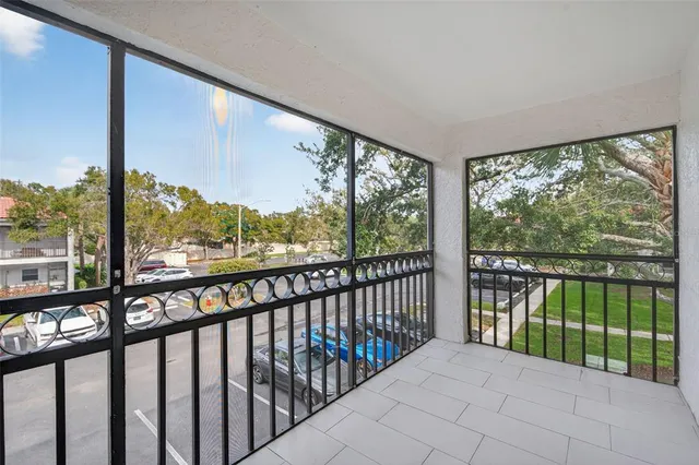 a car parked in front of a white house