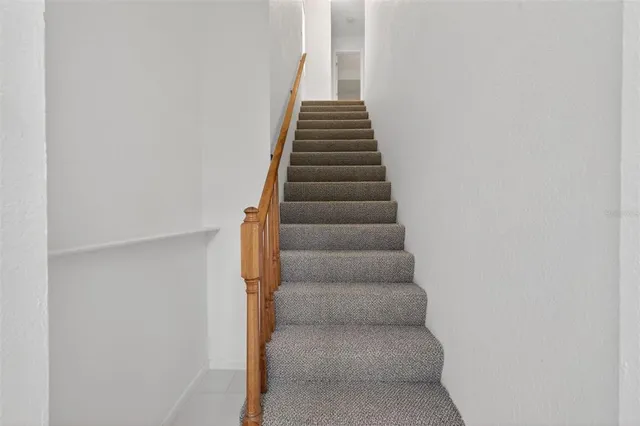 a kitchen with stainless steel appliances granite countertop a stove a refrigerator and a microwave