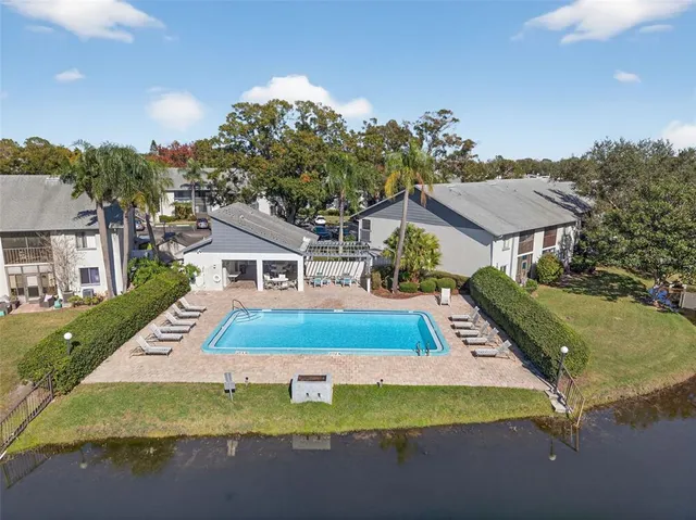 an aerial view of residential houses with outdoor space