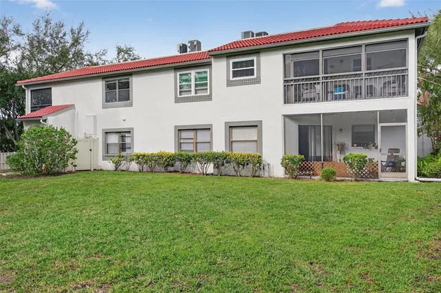 an aerial view of a house with a ocean view