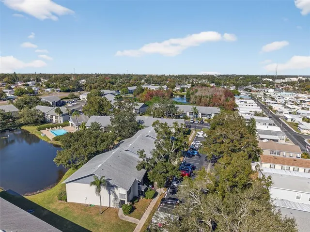 an aerial view of house with yard swimming pool and outdoor seating
