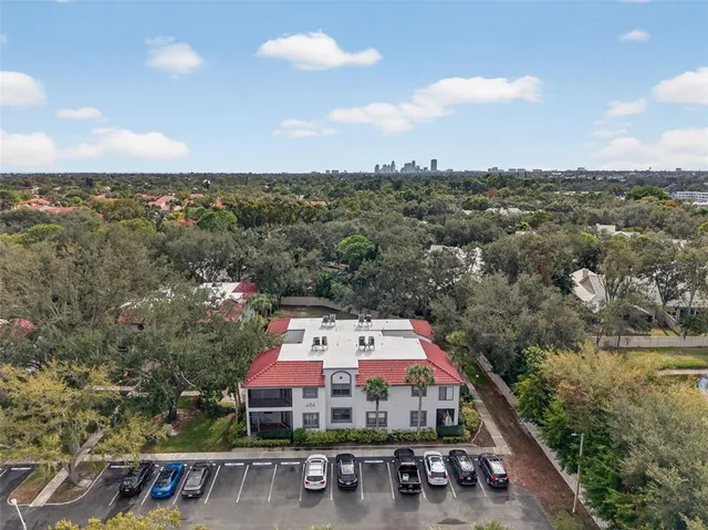an aerial view of residential houses with outdoor space and street view