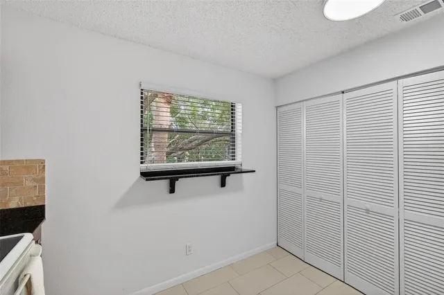 a utility room with sink dryer and washer