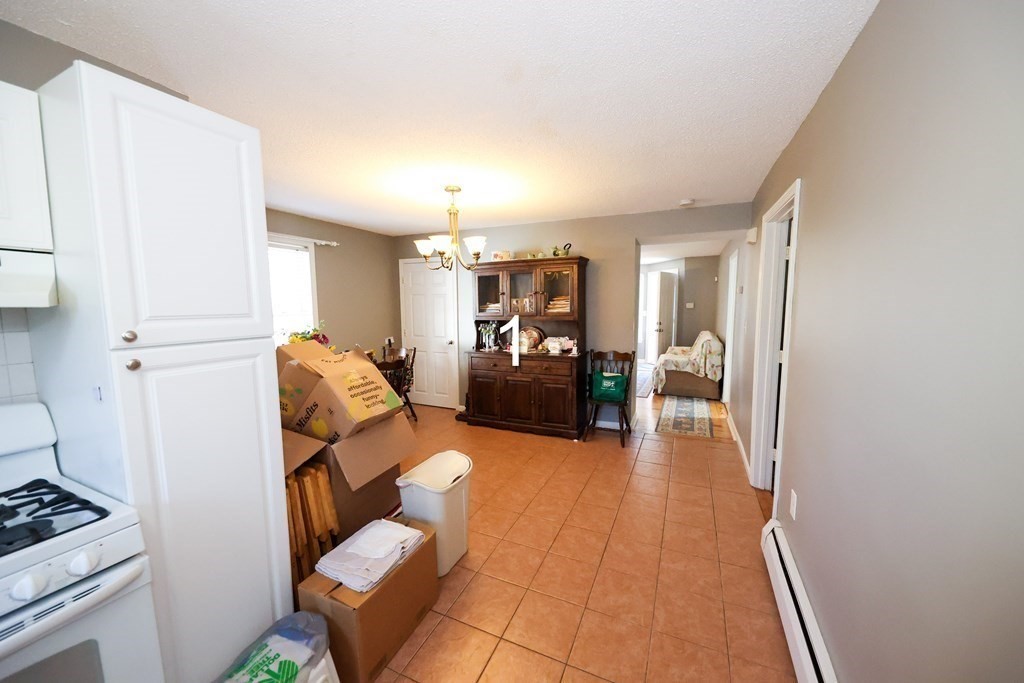 459 Snell Street Fall River, MA 02721 - Photo 16 of 42 a living room with furniture and a wooden floor