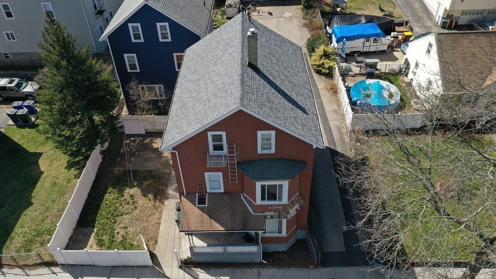 459 Snell Street Fall River, MA 02721 - Photo 2 of 42 a front view of a house with a yard
