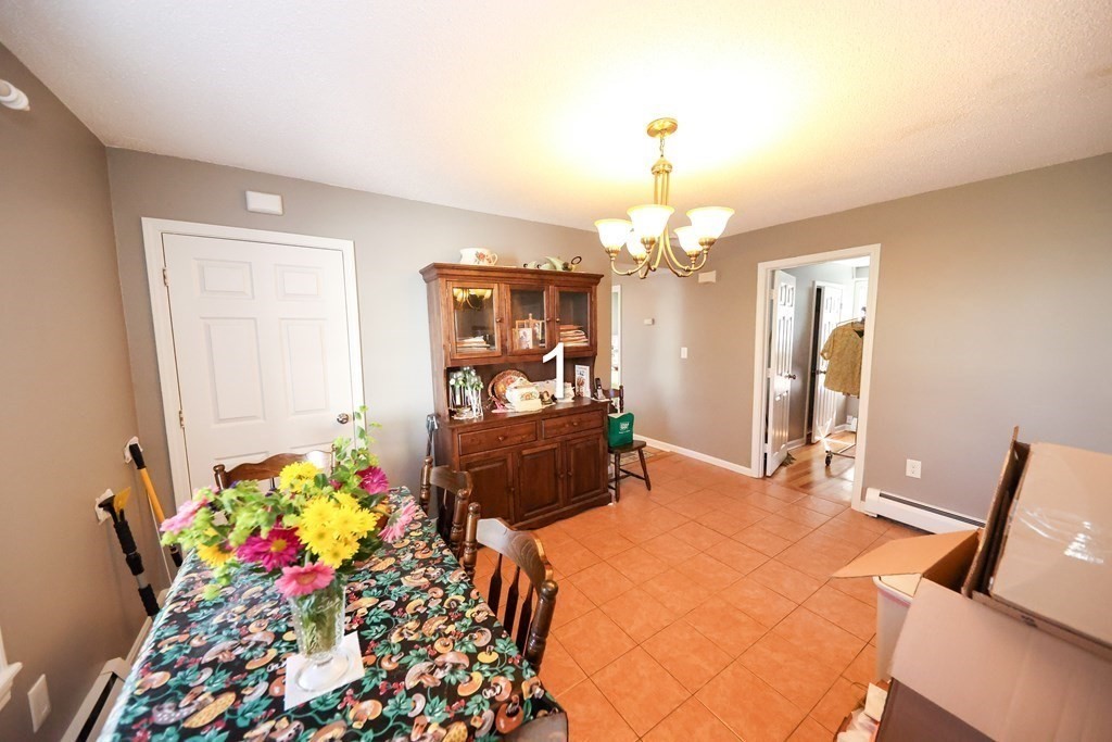 459 Snell Street Fall River, MA 02721 - Photo 21 of 42 a bedroom with furniture and a chandelier