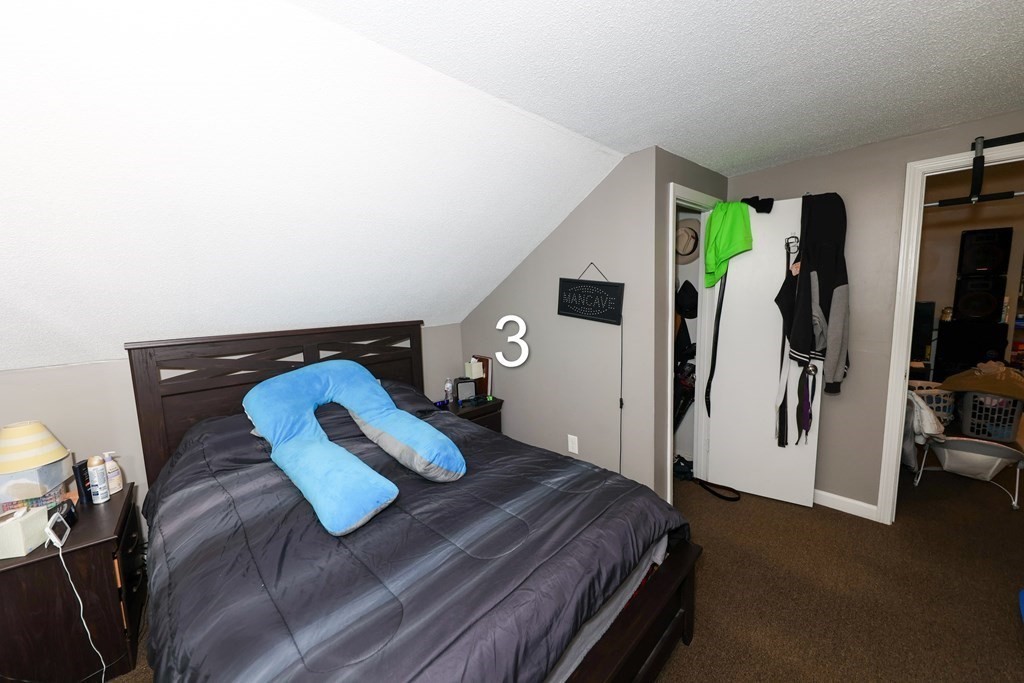 459 Snell Street Fall River, MA 02721 - Photo 26 of 42 a bedroom with a bed and a window