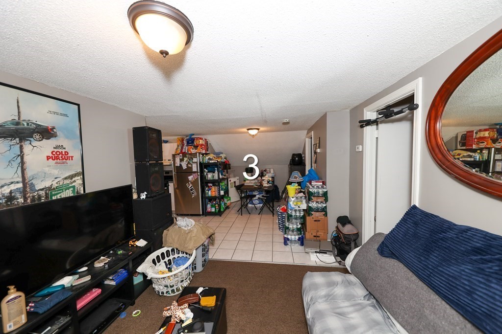 459 Snell Street Fall River, MA 02721 - Photo 30 of 42 a view of a livingroom with furniture and toys