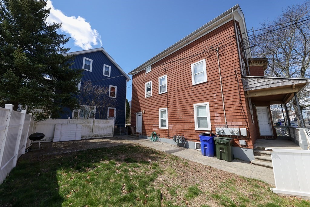 459 Snell Street Fall River, MA 02721 - Photo 34 of 42 a view of a house with a yard