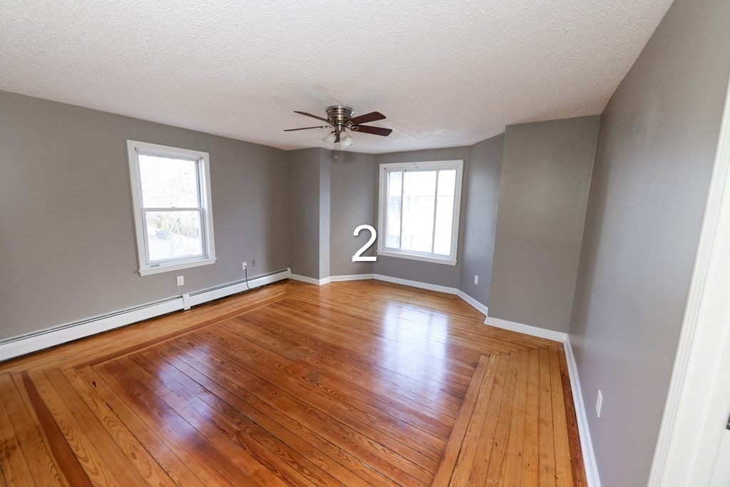 459 Snell Street Fall River, MA 02721 - Photo 4 of 42 wooden floor in an empty room with a window