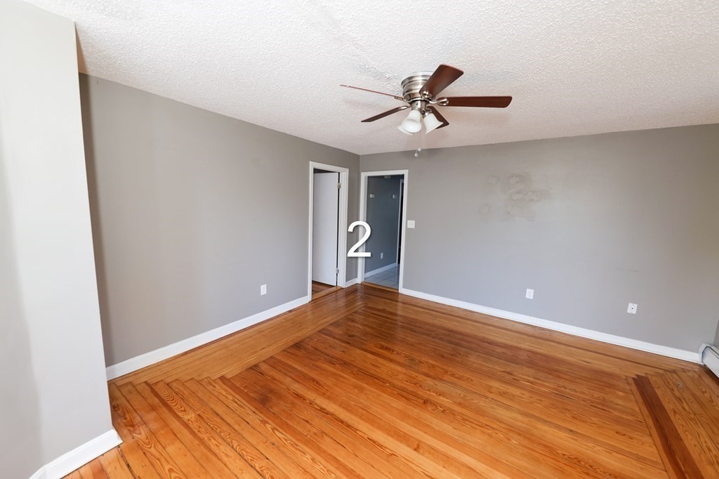 459 Snell Street Fall River, MA 02721 - Photo 5 of 42 a view of empty room with wooden floor