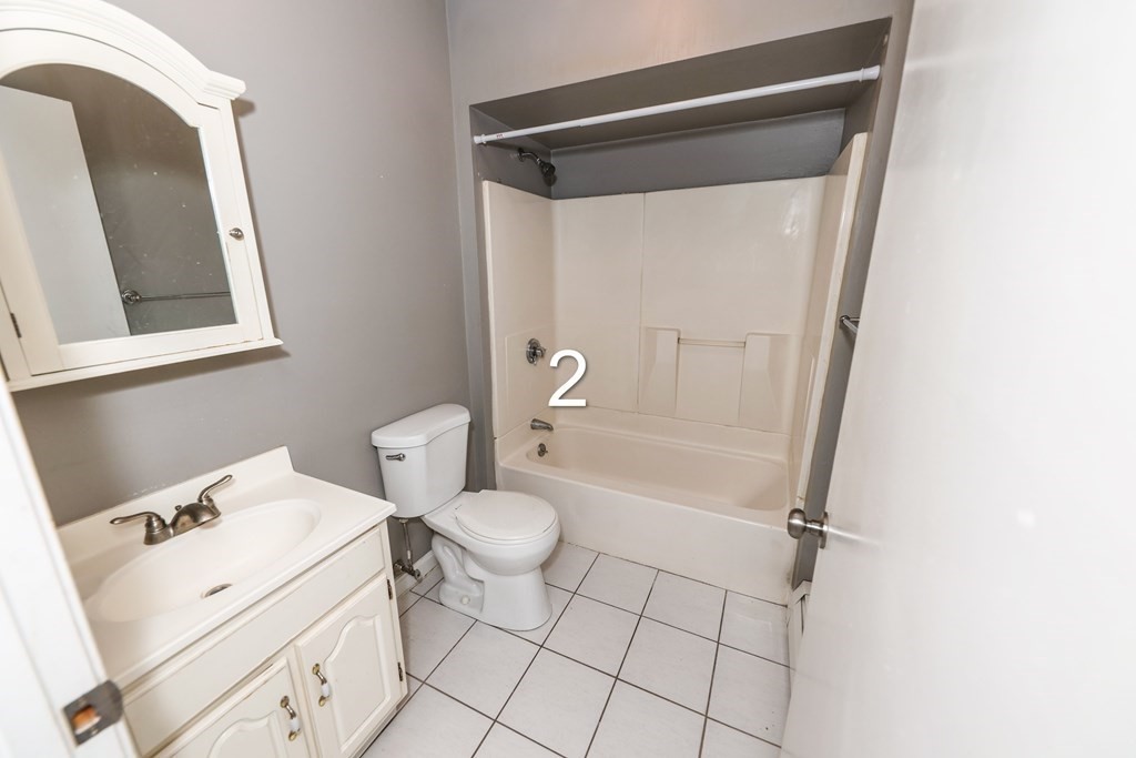 459 Snell Street Fall River, MA 02721 - Photo 10 of 42 a bathroom with a toilet and a shower