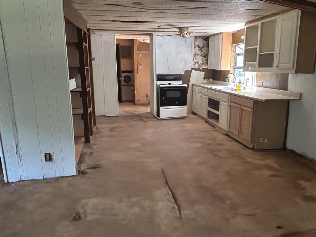120 Timber Trail Mabank, TX 75156 - Photo 12 of 12 a view of a kitchen with a sink and dishwasher a refrigerator with a dishwasher