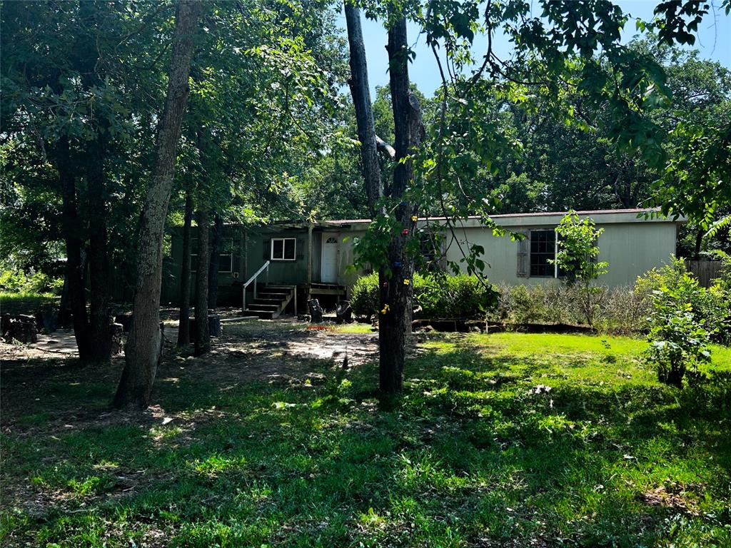 120 Timber Trail Mabank, TX 75156 - Photo 2 of 12 a view of a garden