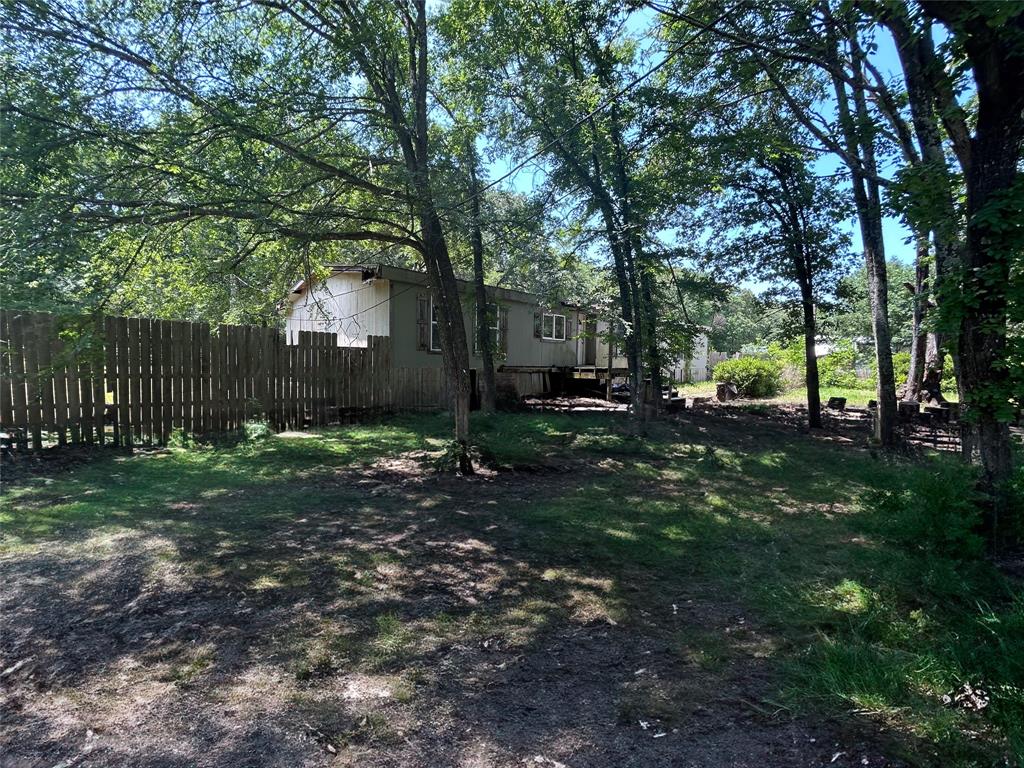 120 Timber Trail Mabank, TX 75156 - Photo 6 of 12 a view of a yard with plants and trees