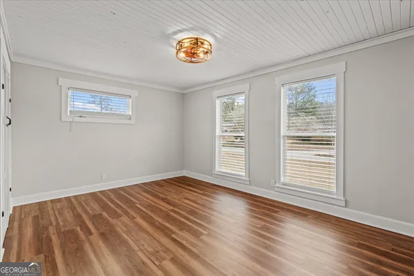 a view of empty room with windows