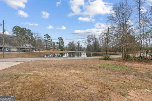 a view of outdoor space with deck and yard