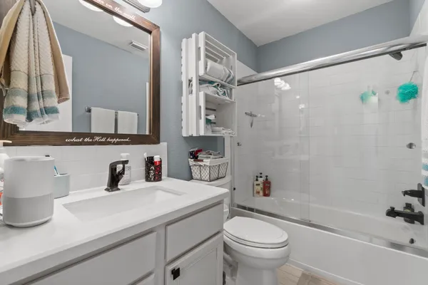 a bathroom with a sink a toilet and a bathtub