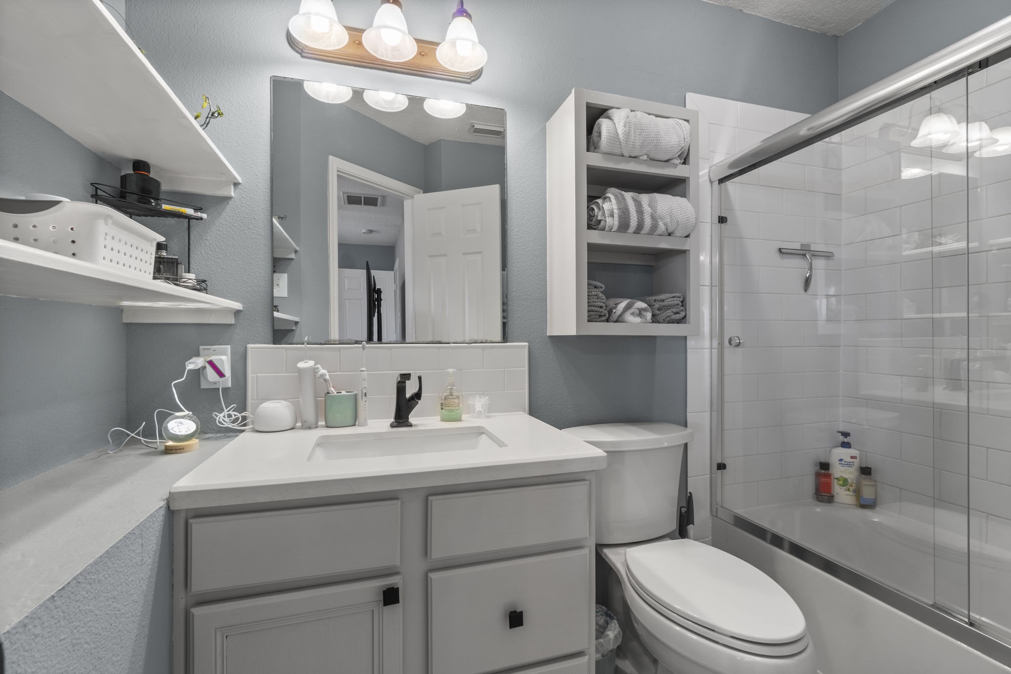 330 Crestmont Point Blank, TX 77364 - Photo 20 of 48 a bathroom with a sink a toilet and shower