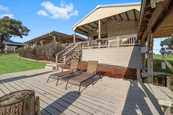 a view of balcony with wooden floor and barbeque oven