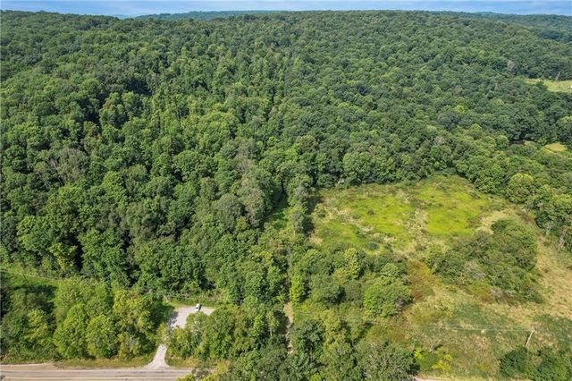 a view of a large yard with lots of green space