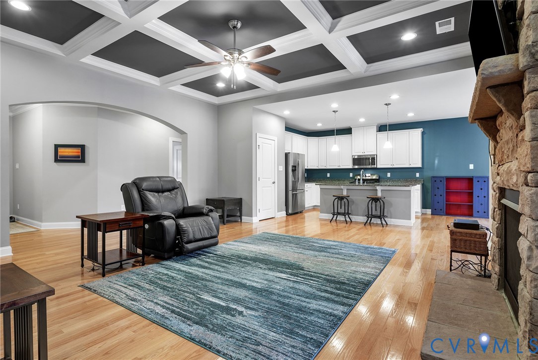 3437 Kendal Crossing Terrace Midlothian, VA 23113 - Photo 10 of 31 a living room with stainless steel appliances kitchen island granite countertop furniture and a kitchen view